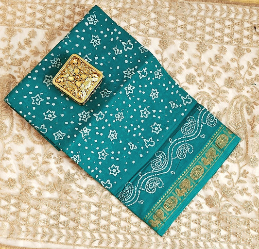 "Graceful Teal Bandhani Saree with Elegant Zari Border"